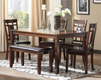Brown dining table set with rectangular table and dark leather-look benches and chairs