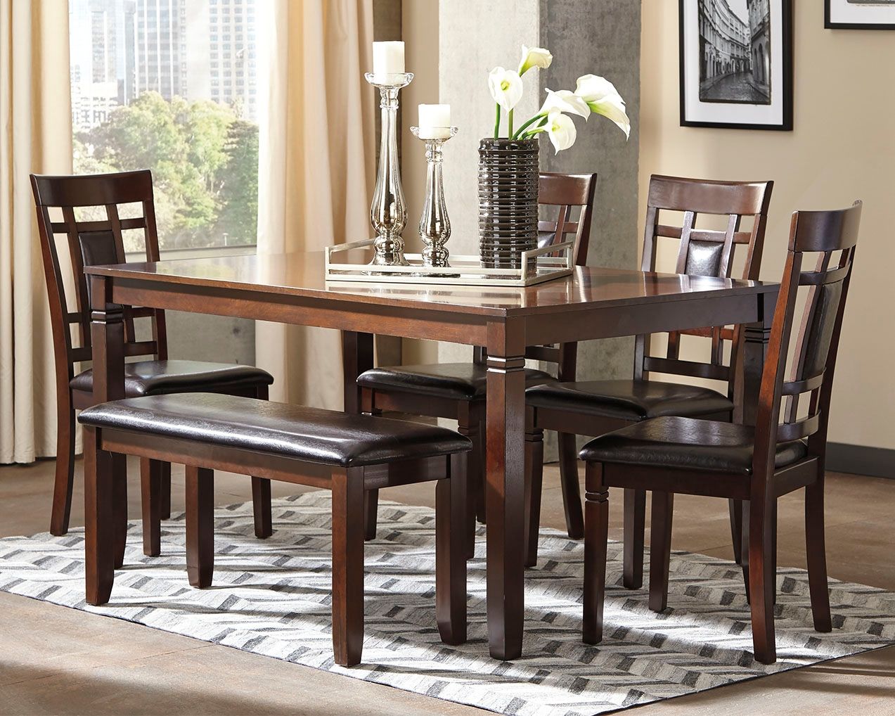 Brown dining table set with rectangular table and dark leather-look benches and chairs