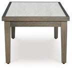 Rectangular cocktail table with light tabletop panel and dark edge trim, brown legs