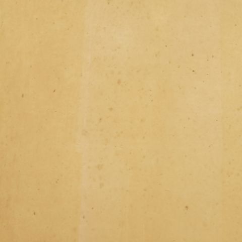 Close-up of amber glass vase surface with speckled texture