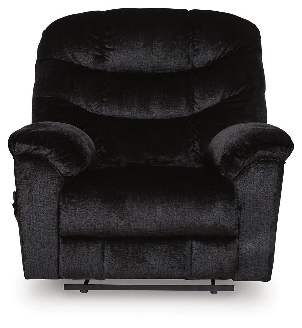 Black upholstered recliner with tufted back cushions, wide arms, and low front base
