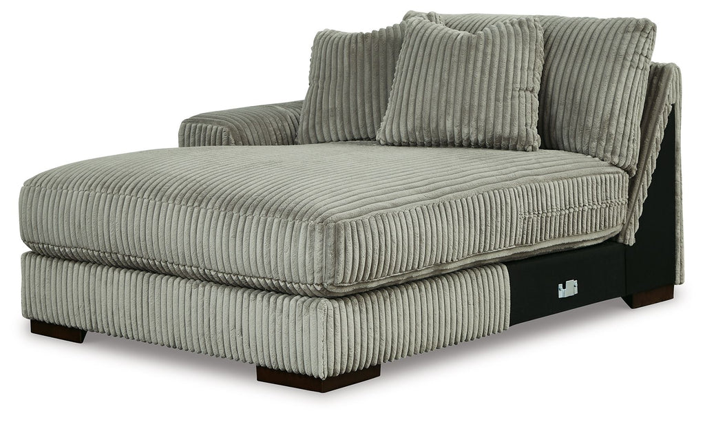 Corner chaise with ribbed fog-gray upholstery, built-in arm and supportive seat cushion