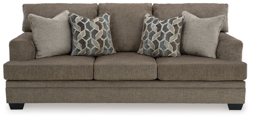 Stonemeade sofa, dark taupe fabric, with four accent pillows and geometric patterns