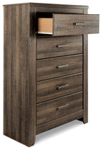 Juararo five-drawer chest in dark brown, top drawer open, side view