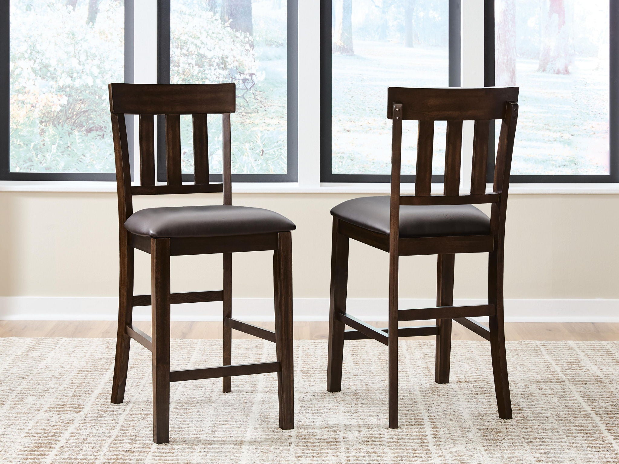 Set of 2 dark brown barstools with padded seats and square slat backrests