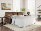 Brown sofa sleeper with pull-out mattress and two back cushions