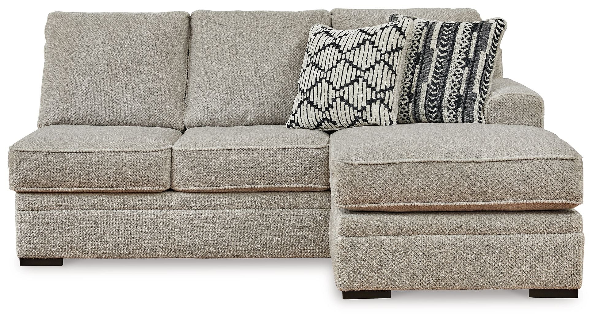 Sofa chaise sectional with light gray upholstery, wide chaise ottoman and patterned cushion