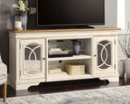 Chipped white TV stand with two cabinet doors, open shelves, and TV on top