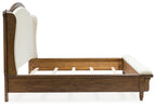 Upholstered panel bed with cream side panel, dark brown wood frame and slatted base