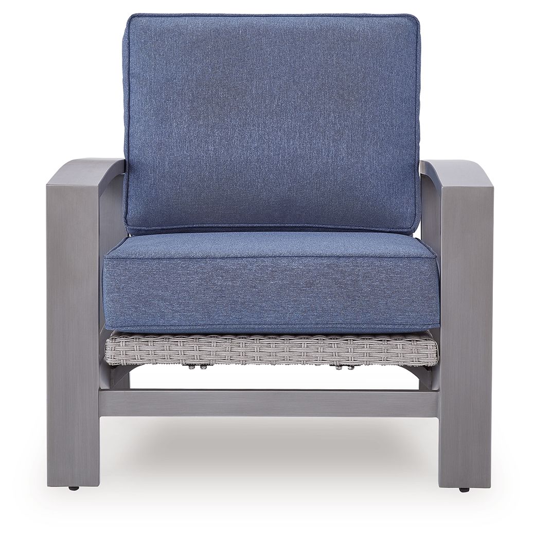 Blue upholstered lounge chair with gray frame, cushioned seat, and woven lower support