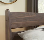 Light brown wooden headboard panel with curved top rail and side posts
