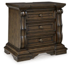Dark brown three-drawer night stand with curved posts and three metal pulls