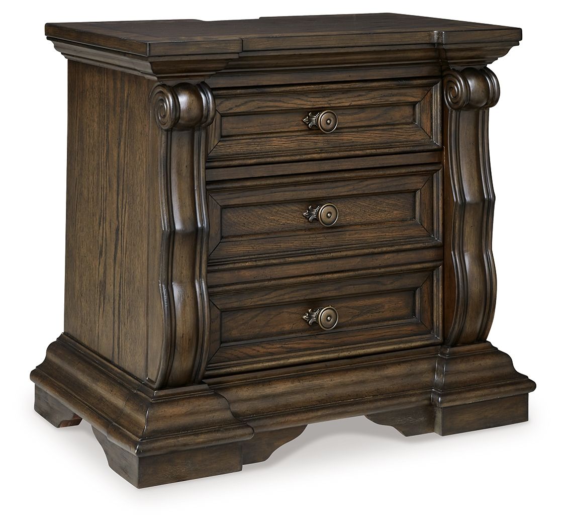 Dark brown three-drawer night stand with curved posts and three metal pulls