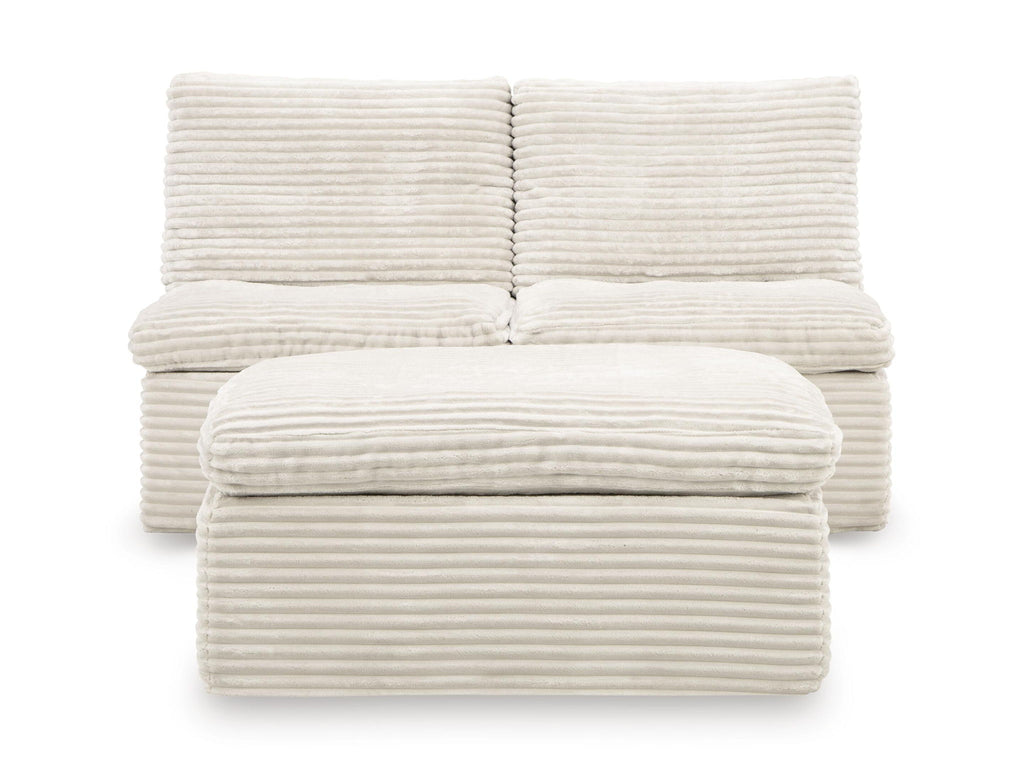 Ivory upholstered armless chair cushions and ottoman, ribbed texture with rounded front seat