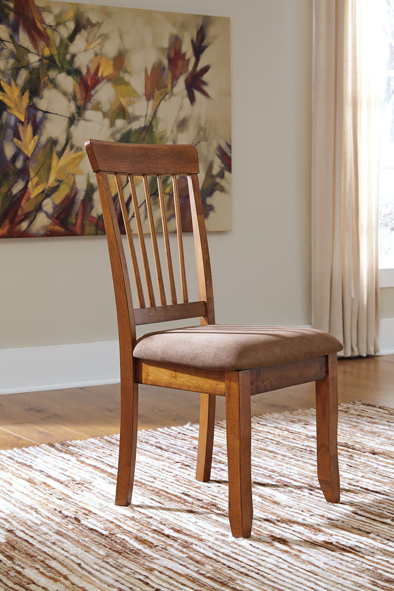 Dark brown dining chair with vertical slat back and padded seat