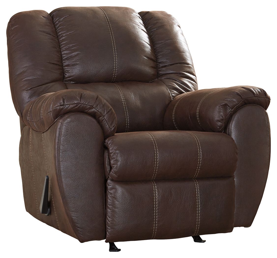 Brown leather rocker recliner with padded armrests, cushioned seat, and recline footrest
