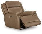 Brown power recliner chair with adjustable headrest, footrest extended, side view