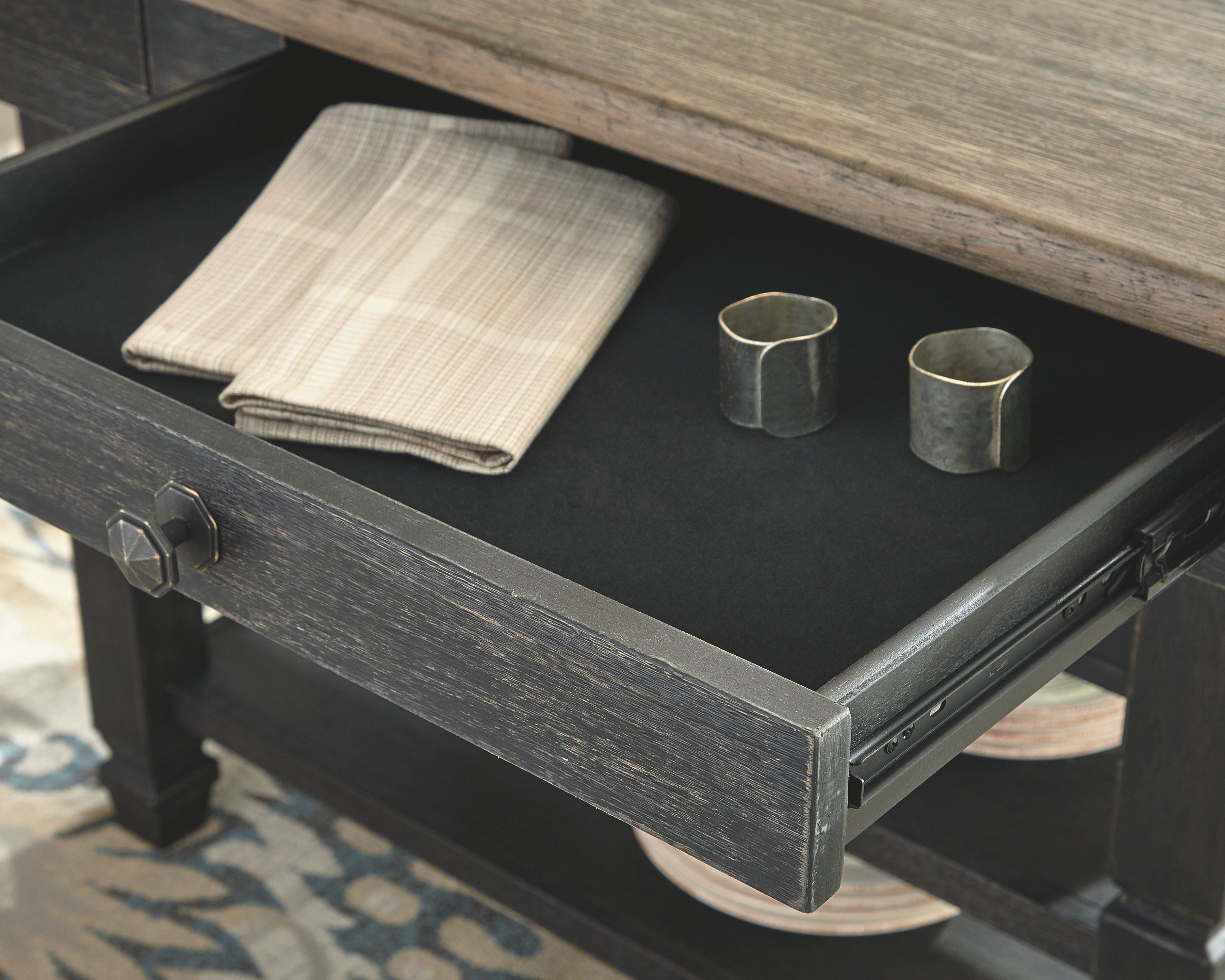 Black rectangular dining counter table with dark gray top and side drawer pull