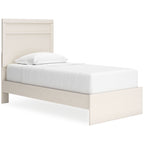 Light wood panel bed with tall headboard and low footboard, white mattress