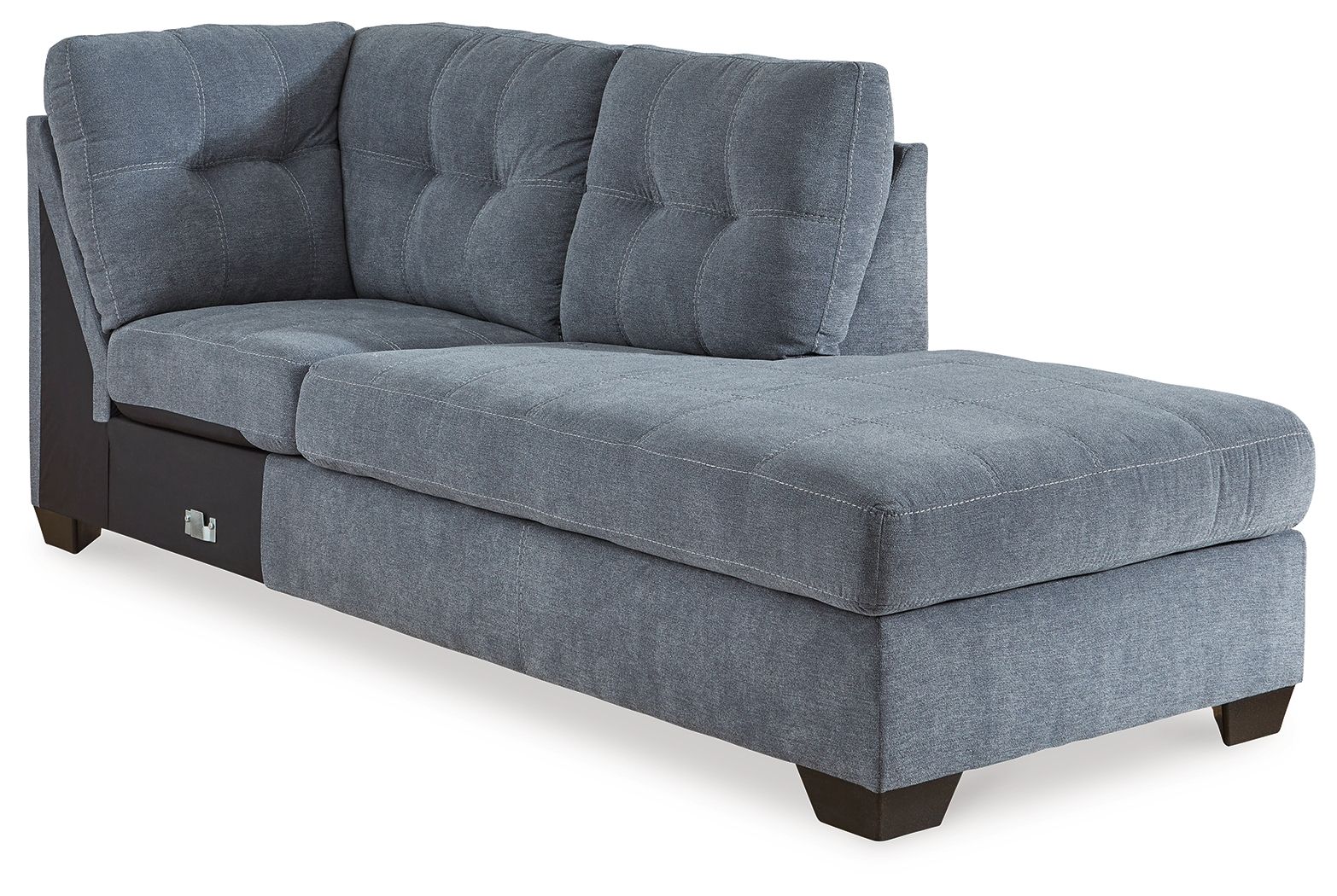 Blue denim corner chaise with tufted back and padded arms on dark legs