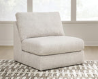 Light beige armless accent chair with thick seat and rounded back