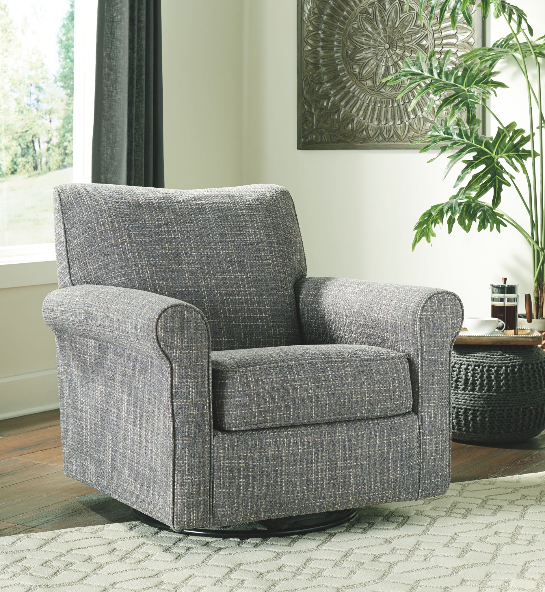 Swivel accent chair in dark gray textured fabric with padded arms and seat