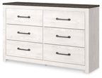 White panel dresser with dark top and four drawers with bar pulls