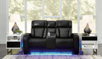 Black power reclining loveseat with console, quilted seats, and padded headrests