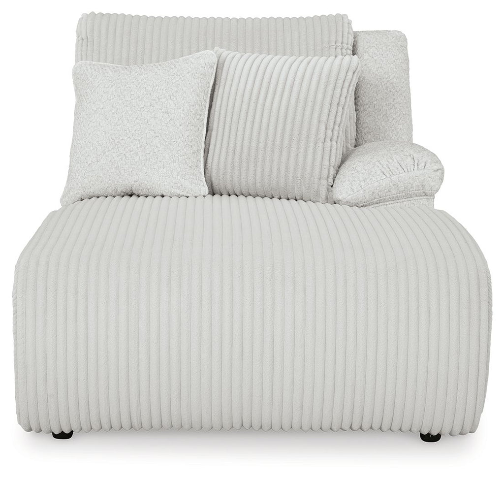 Light gray striped upholstered chaise lounge with three back cushions and track arms
