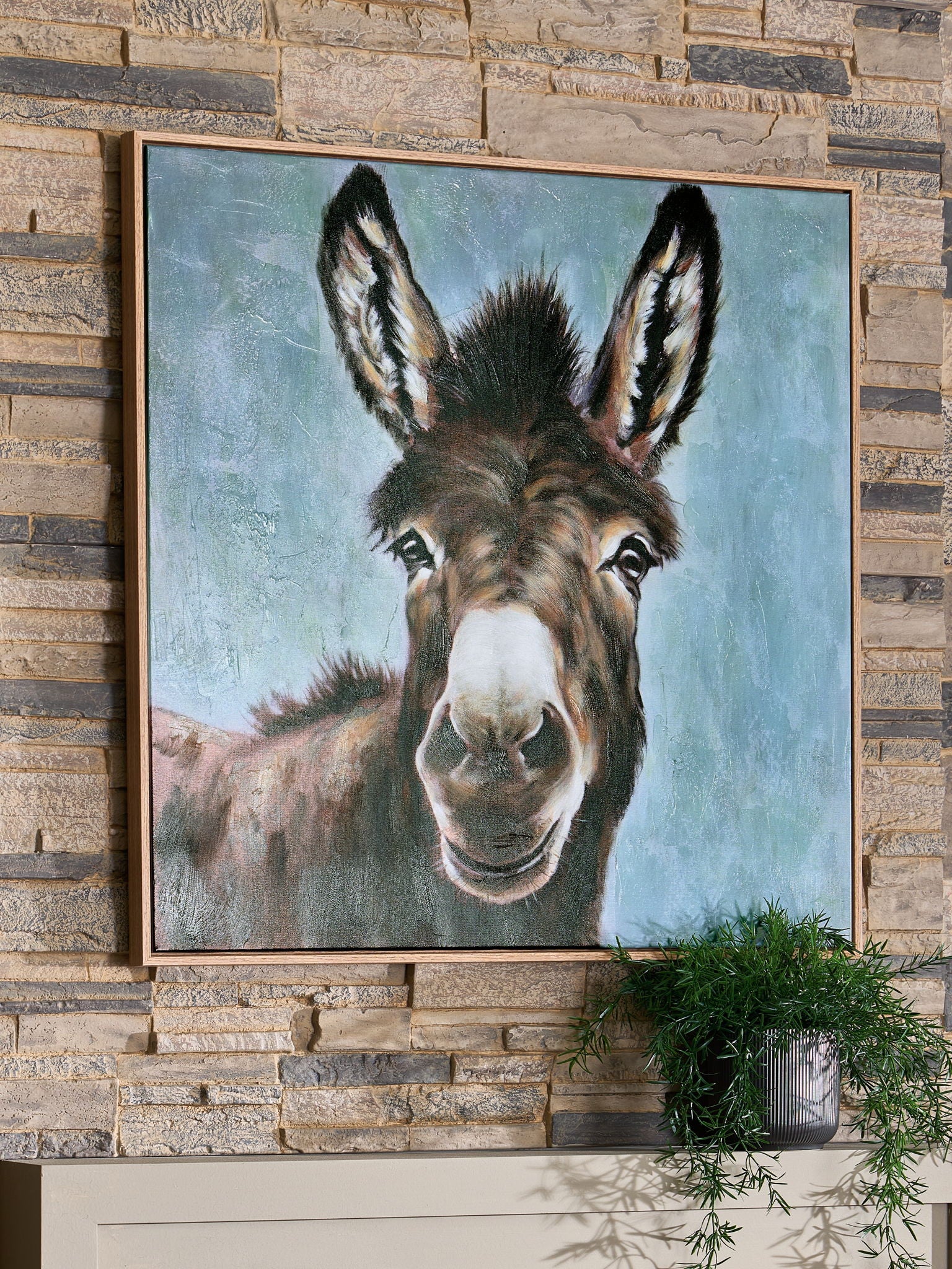 Framed donkey portrait wall art with dark ears and white muzzle on light blue