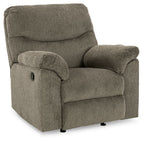 Alphons rocker recliner in putty fabric with padded arms and recline base, side view