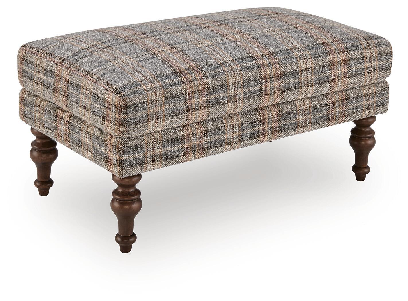 Multi plaid upholstered accent ottoman with tufted top and dark turned wooden legs