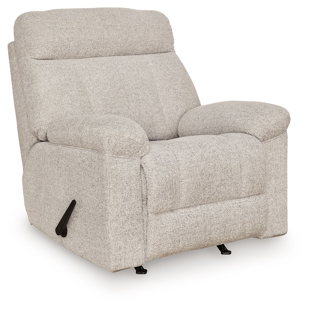 Rocker recliner chair in light beige-gray fabric, side view with smooth arm panels