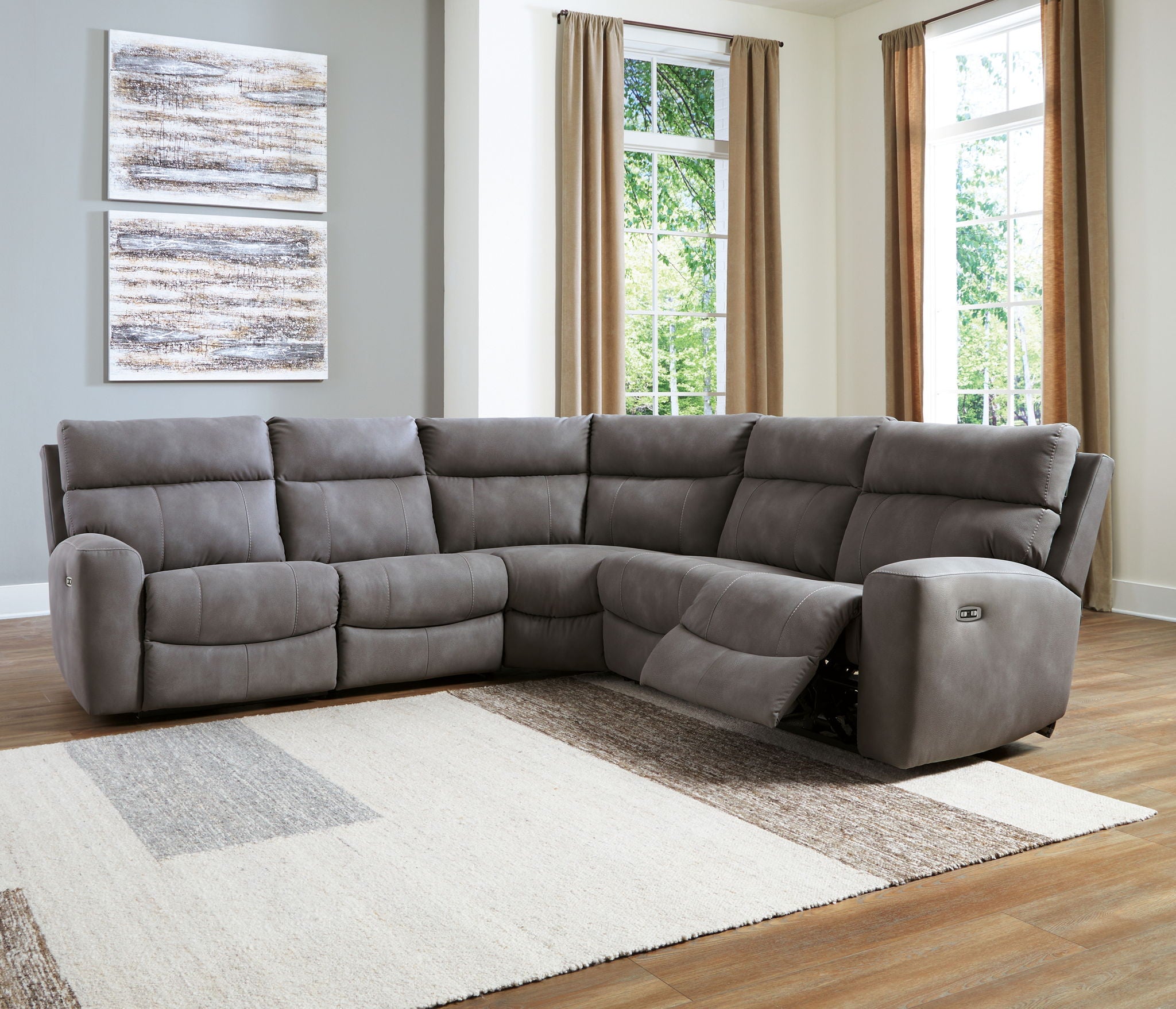 Dark gray power reclining sectional sofa with corner chaise and padded recliner arms