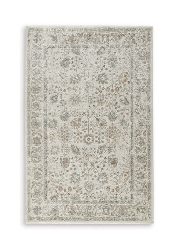 Beige area rug featuring all-over floral motifs with faded central design