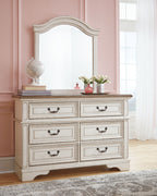 White dresser with mirror and six drawers, decorative frame and curved skirt base.