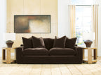 Dark brown fabric sofa with rounded seat and five back pillows, low profile