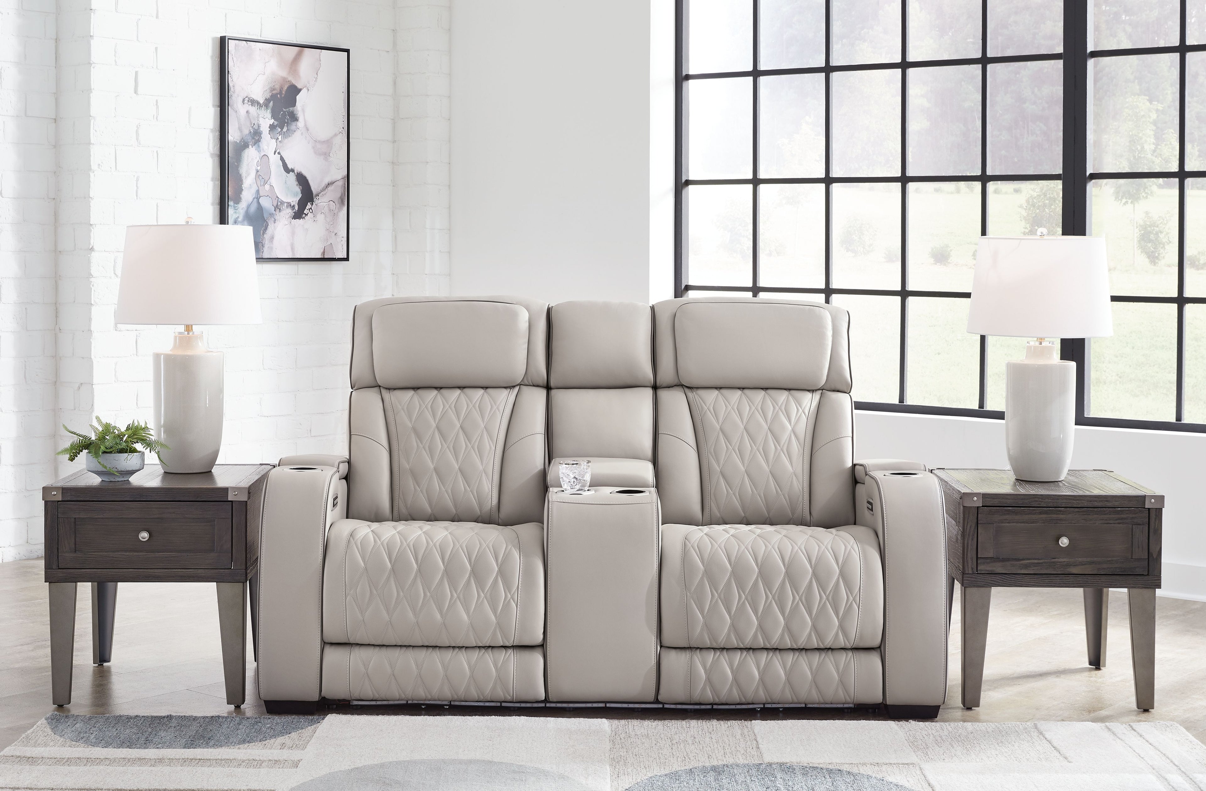 Gray power reclining loveseat with console and diamond-quilted seats and back cushions