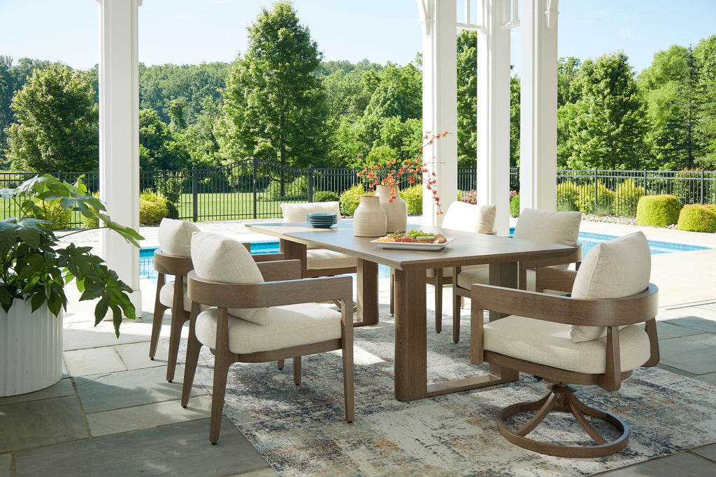 Outdoor dining set with dark brown table and beige-cushioned armchairs on patio