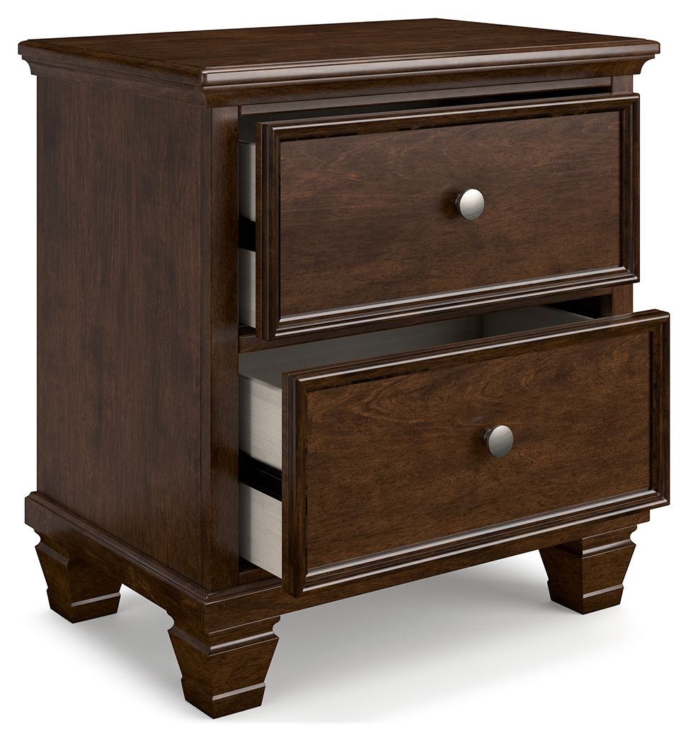 Brown two-drawer nightstand showing side panel and round metal knobs