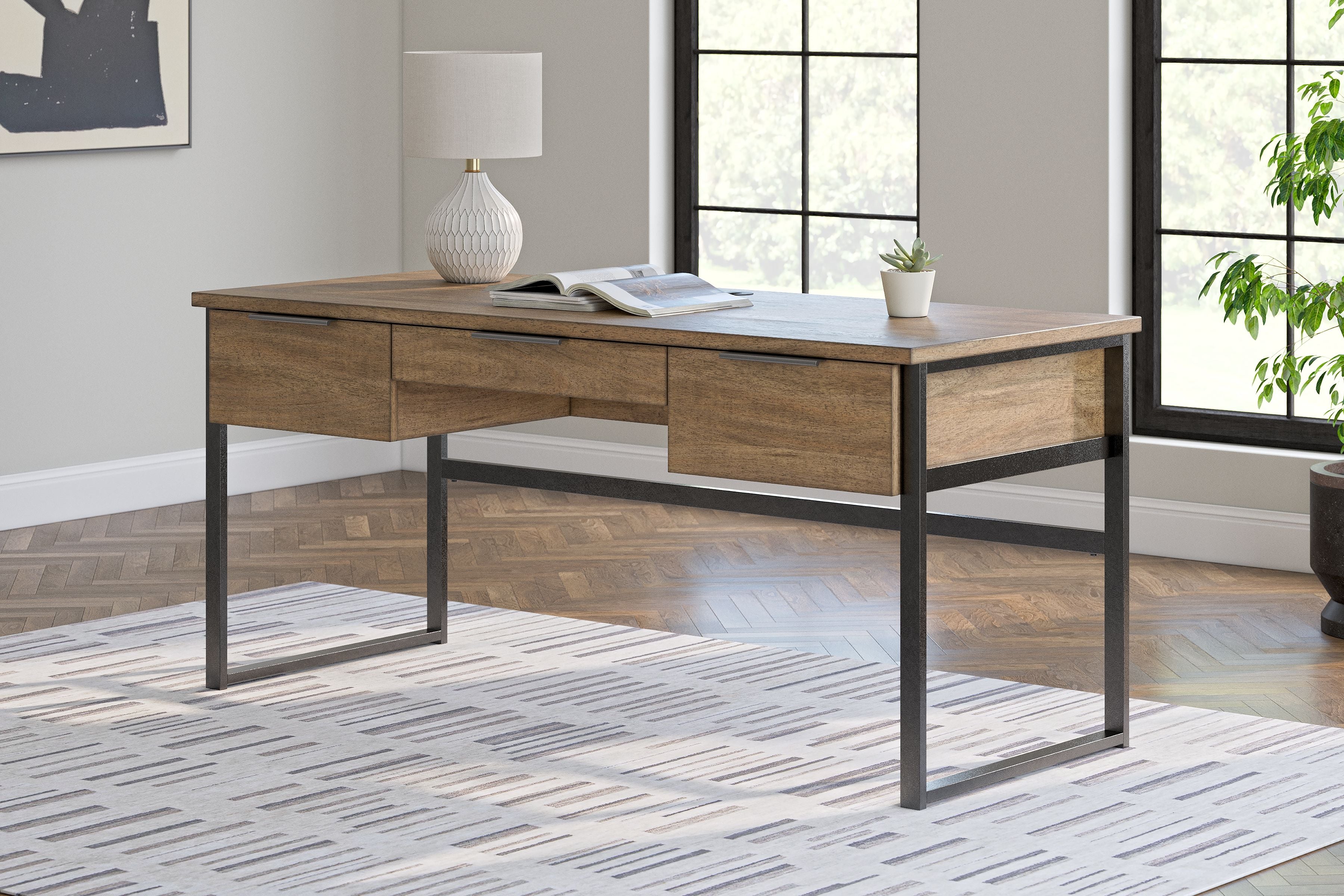 Light brown home office desk with built-in drawers and black metal legs, wide work surface