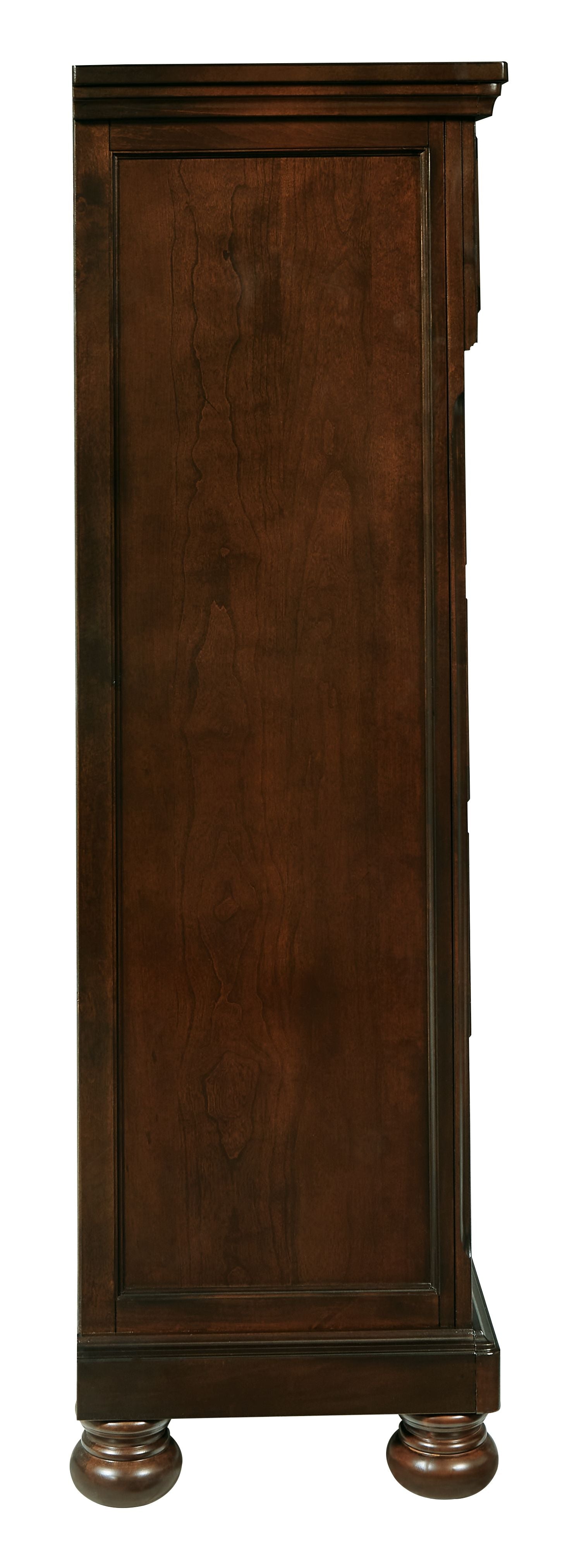 Rustic brown chest of drawers side view with turned feet and panel detailing
