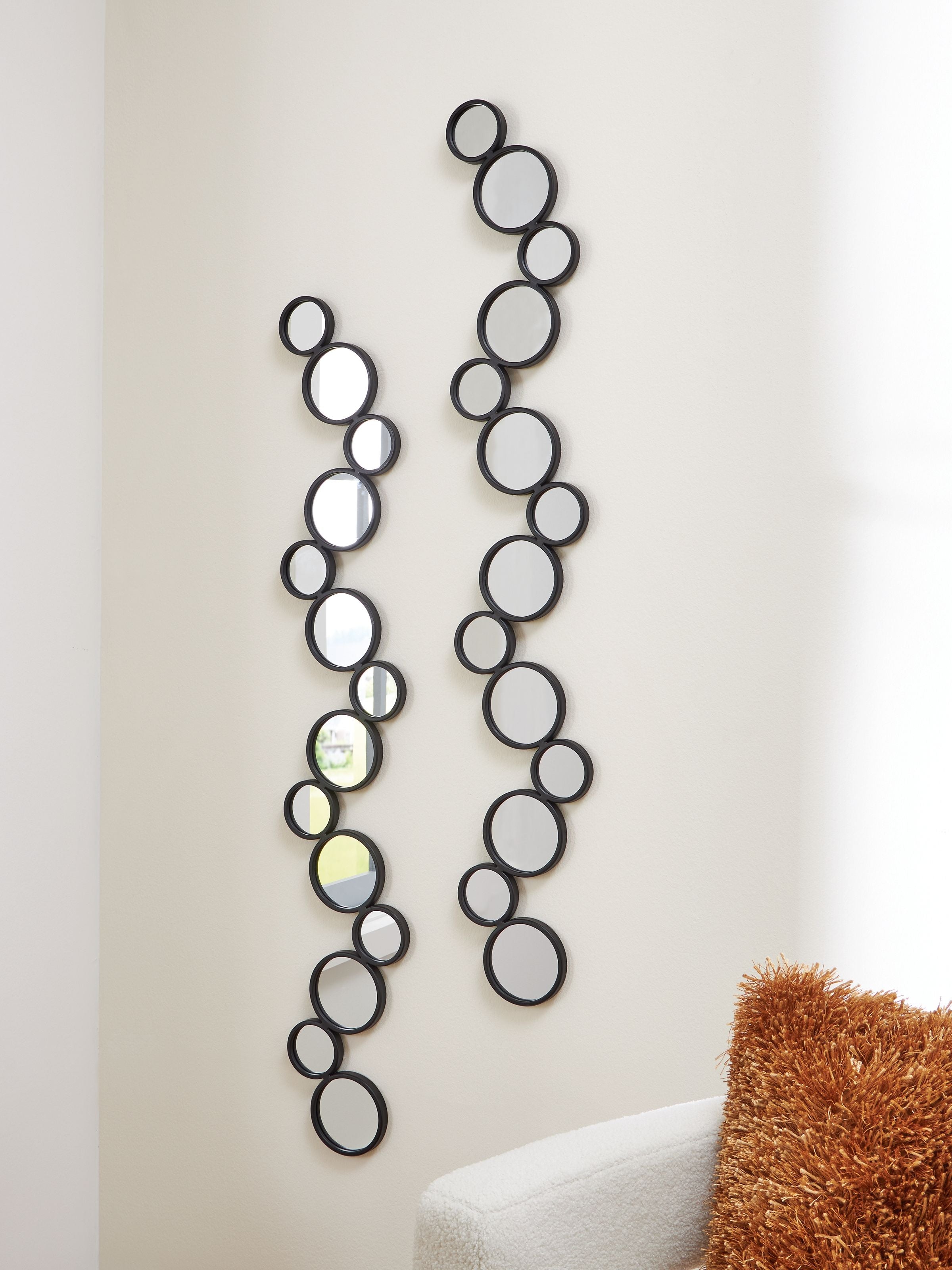 Set of 2 black round accent mirrors, slim vertical oval-like circle clusters