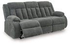 Reclining power sofa, dark gray fabric, reclined with extended footrest