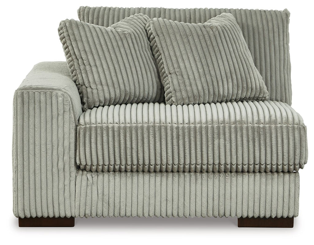 Fog gray corduroy corner chair with tufted seat front and three back pillows