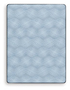 Blue mattress top with geometric pattern and rounded corners