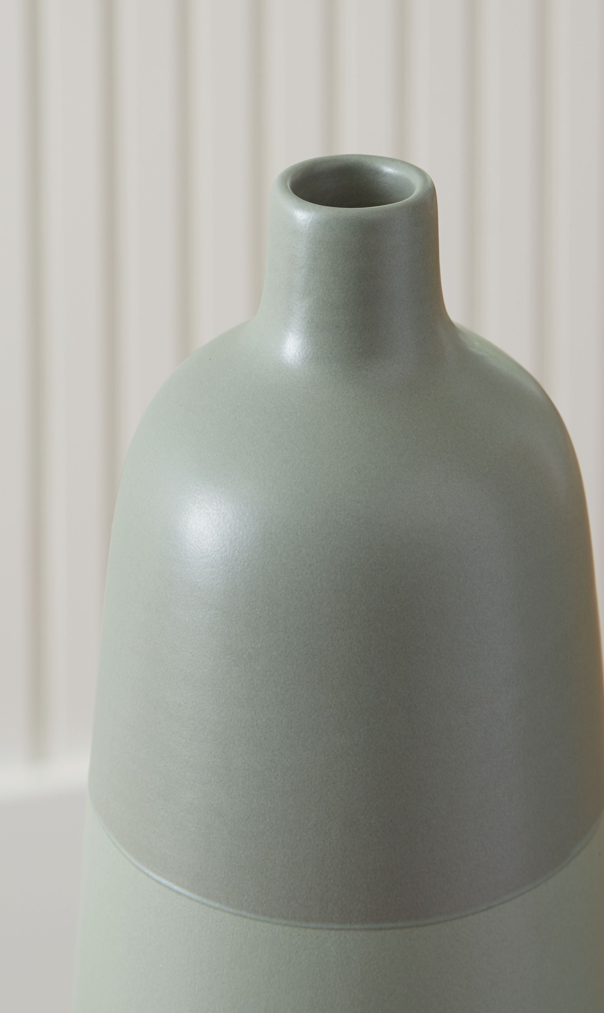 Sage green ceramic vase with wide round belly and short opening
