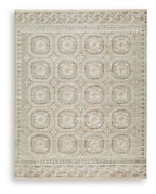 Light beige rug with geometric medallion pattern and decorative border