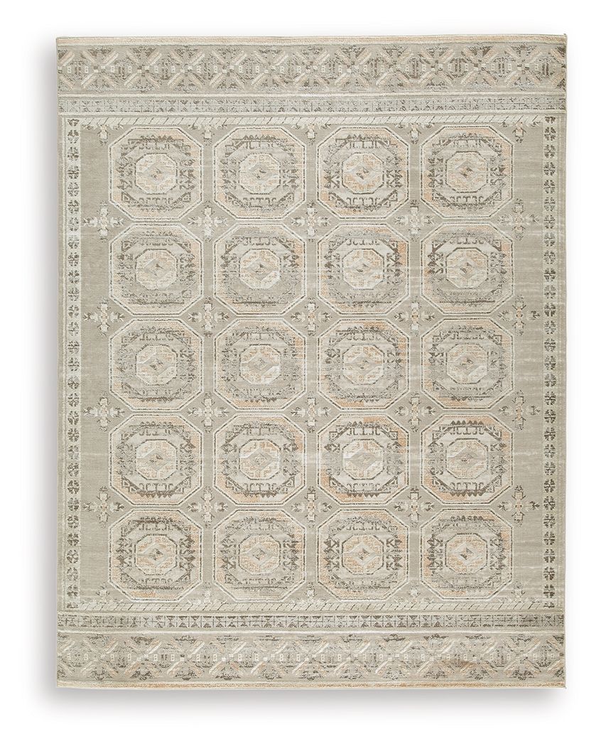 Light beige rug with geometric medallion pattern and decorative border