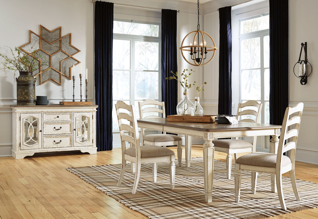Rectangular dining table with white spindle-back chairs in coordinated dining set
